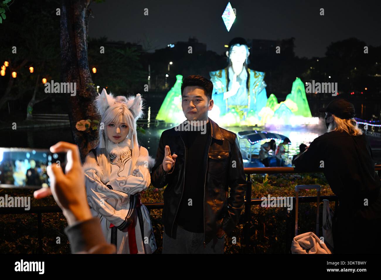 Visitors admire lantersn at the Spring Festival Lantern Show in Yuexiu ...