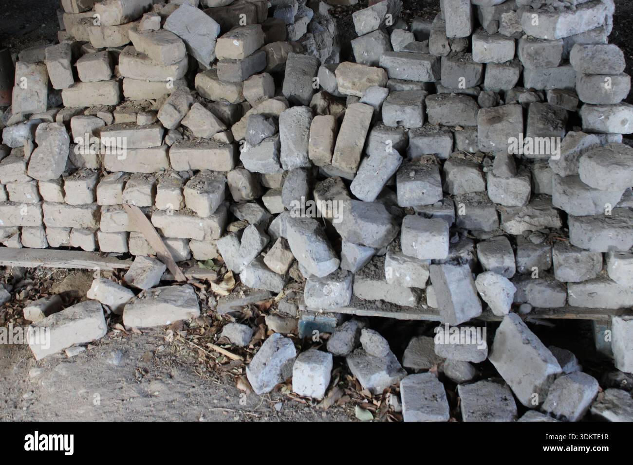 Stack of Old Concrete Bricks in Abandoned Structure Stock Photo