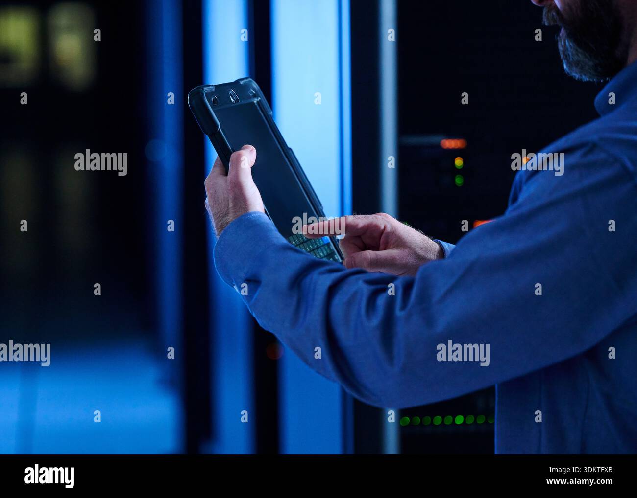 Close-up of man using tablet in data center Stock Photo