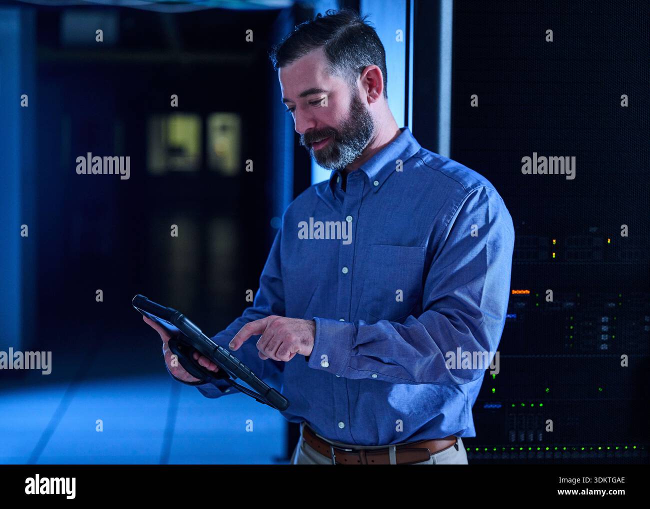Man using tablet in data center Stock Photo