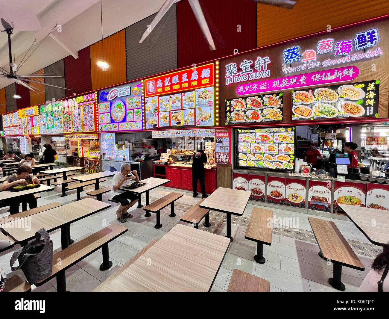 New coffeeshop business with bright and loud colour signage to attract customers in the hyper competitive challenges market. Singapore - Smartphone Captured Stock Image