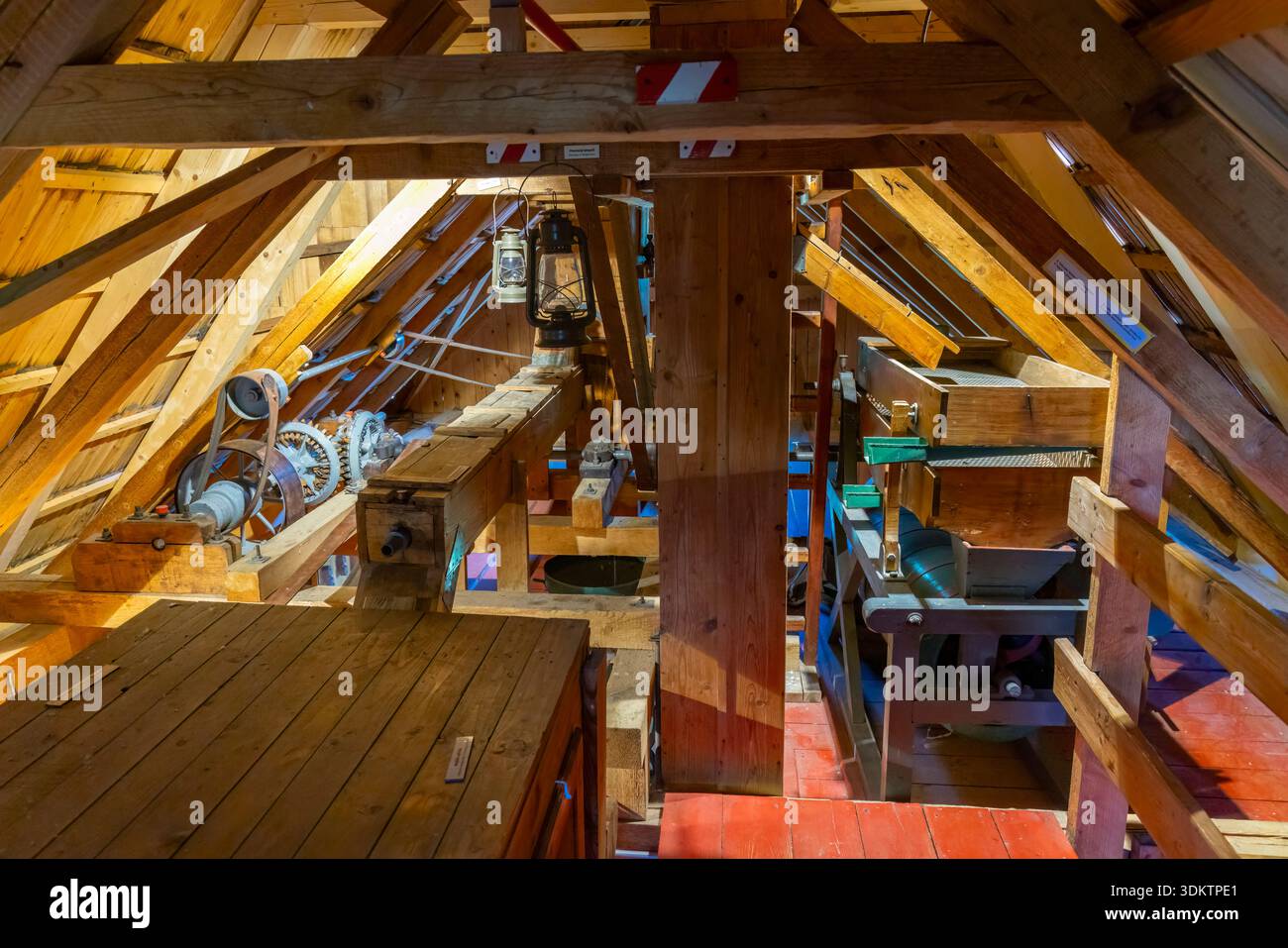 Inside historic wooden windmill attic showcasing traditional gears and ...
