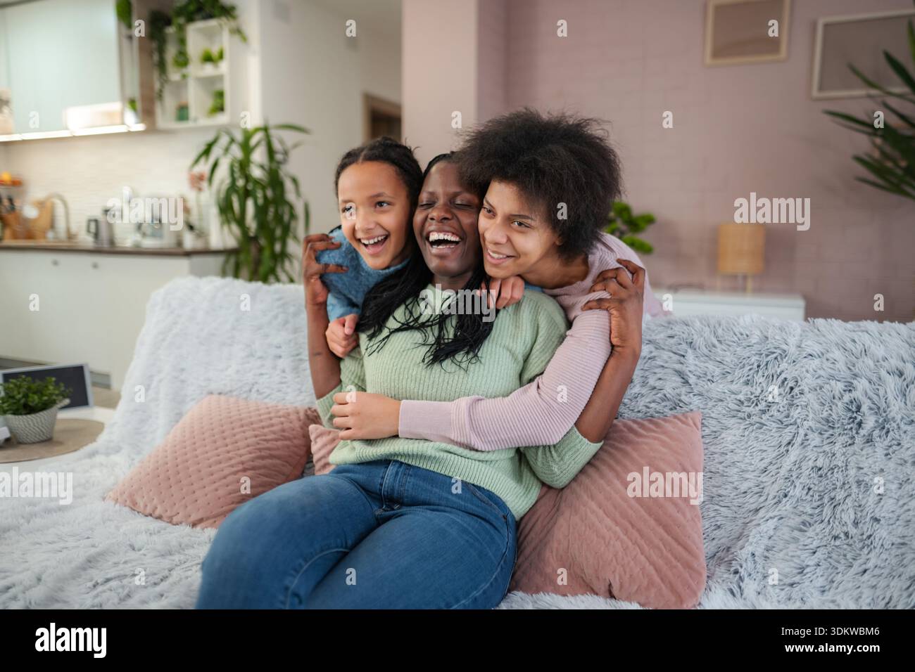 Black family laughing hi-res stock photography and images - Alamy