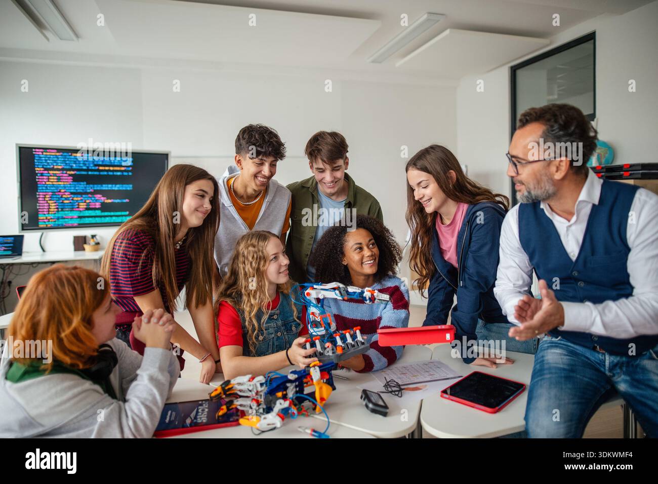 Young students working on robotics project at school, learning programming. Stock Photo