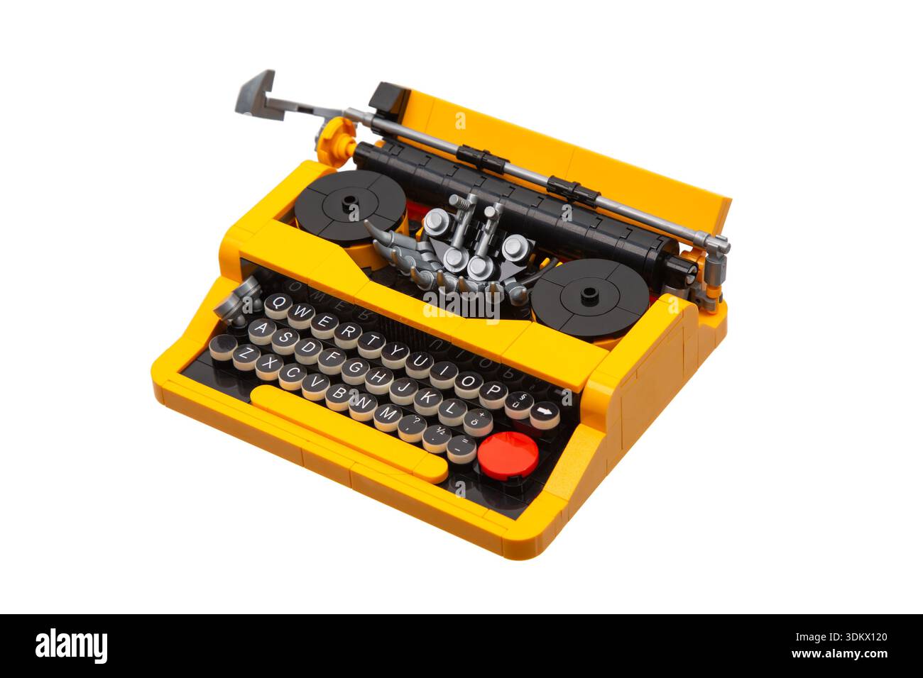 Yellow and black toy construction block typewriter model isolated on white background. Stock Photo