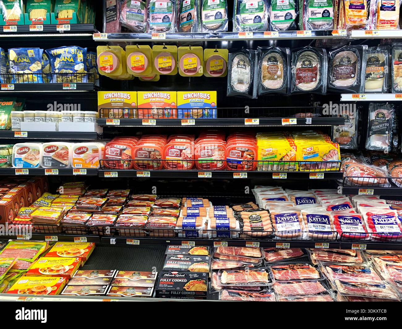 Packaged meat section at grocery store Stock Photo - Alamy