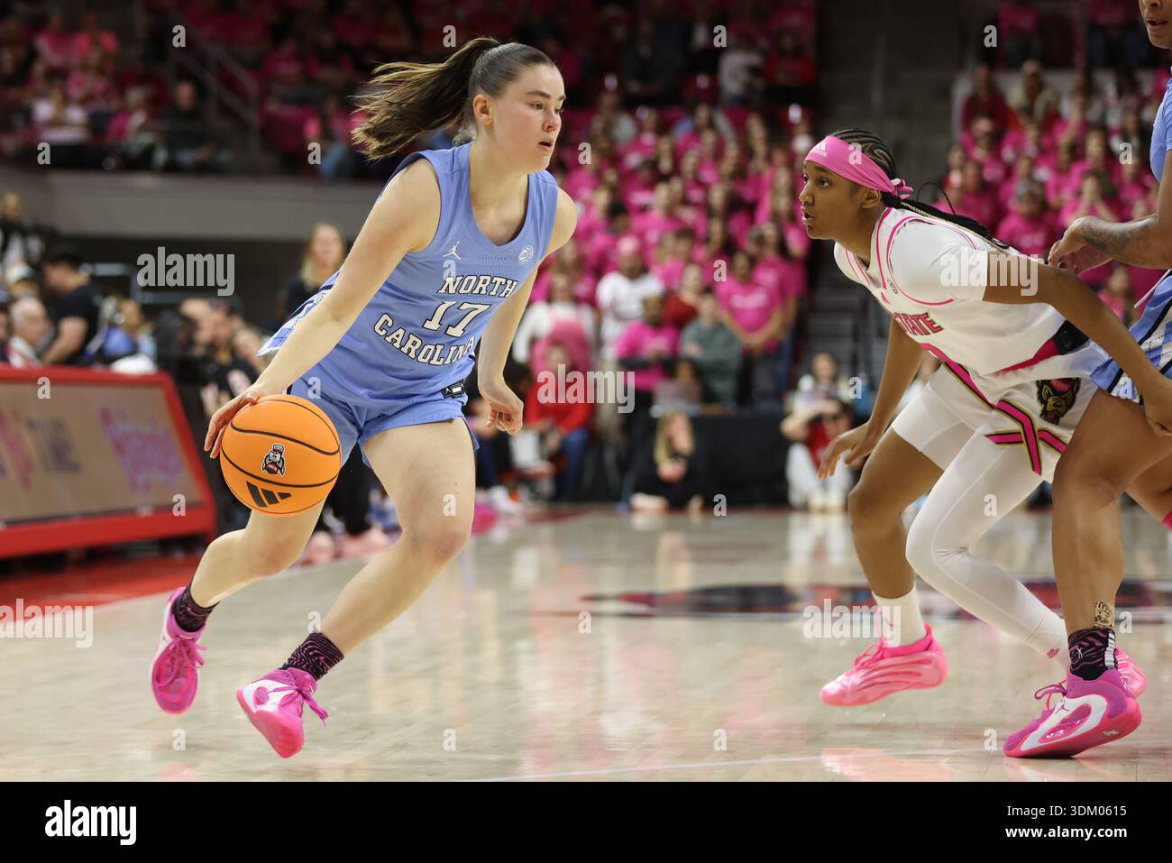 RALEIGH, NC - FEBRUARY 02: Elina Aarnisalo #17 of the UNC Tar Heels drives  to the paint during the Play4Kay college basketball game between the UNC  Tar Heels and the NC State