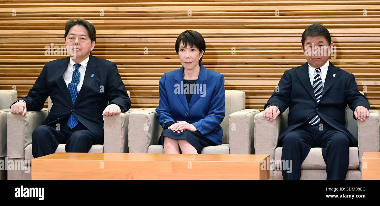 Japanese Prime Minister Sanae Takaichi (C) attends a cabinet meeting at ...