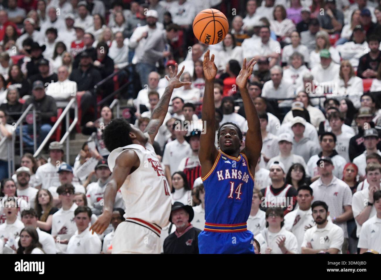 Texas Tech guard Jaylen Petty, left, attempts to block a shot by Kansas ...