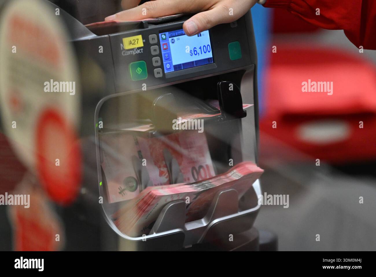 Money detector checking the Hong Kong dollar of new bank note for Lunar ...