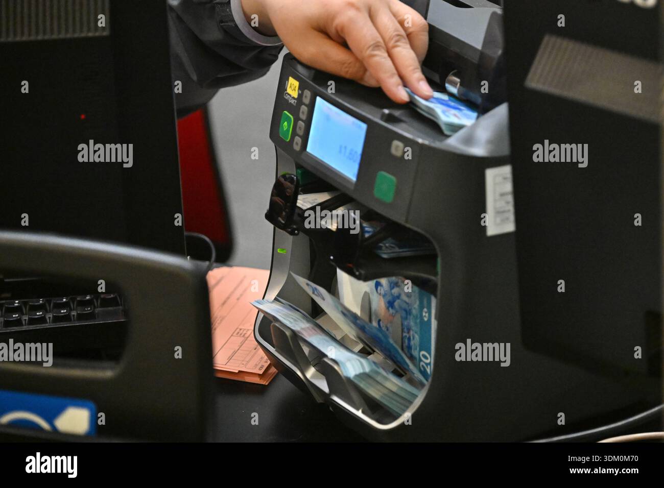 Money detector checking the Hong Kong dollar of new bank note for Lunar ...