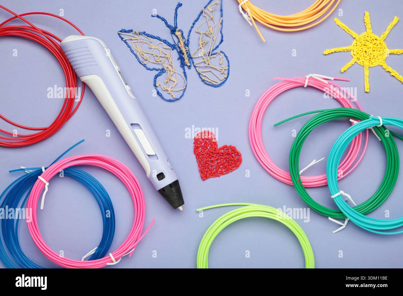 3d handle pen and 3d painting figures on purple background Stock Photo