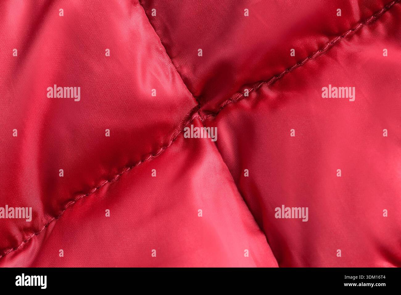 Red stitched waterproof fabric closeup as a background Stock Photo
