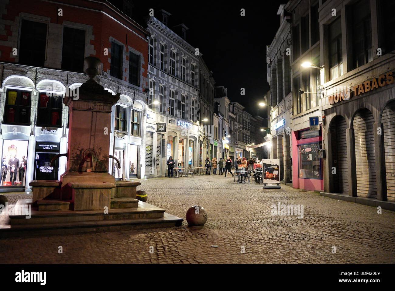 Night street in Mons Belgium on 7 February 2025 with storefronts Stock ...