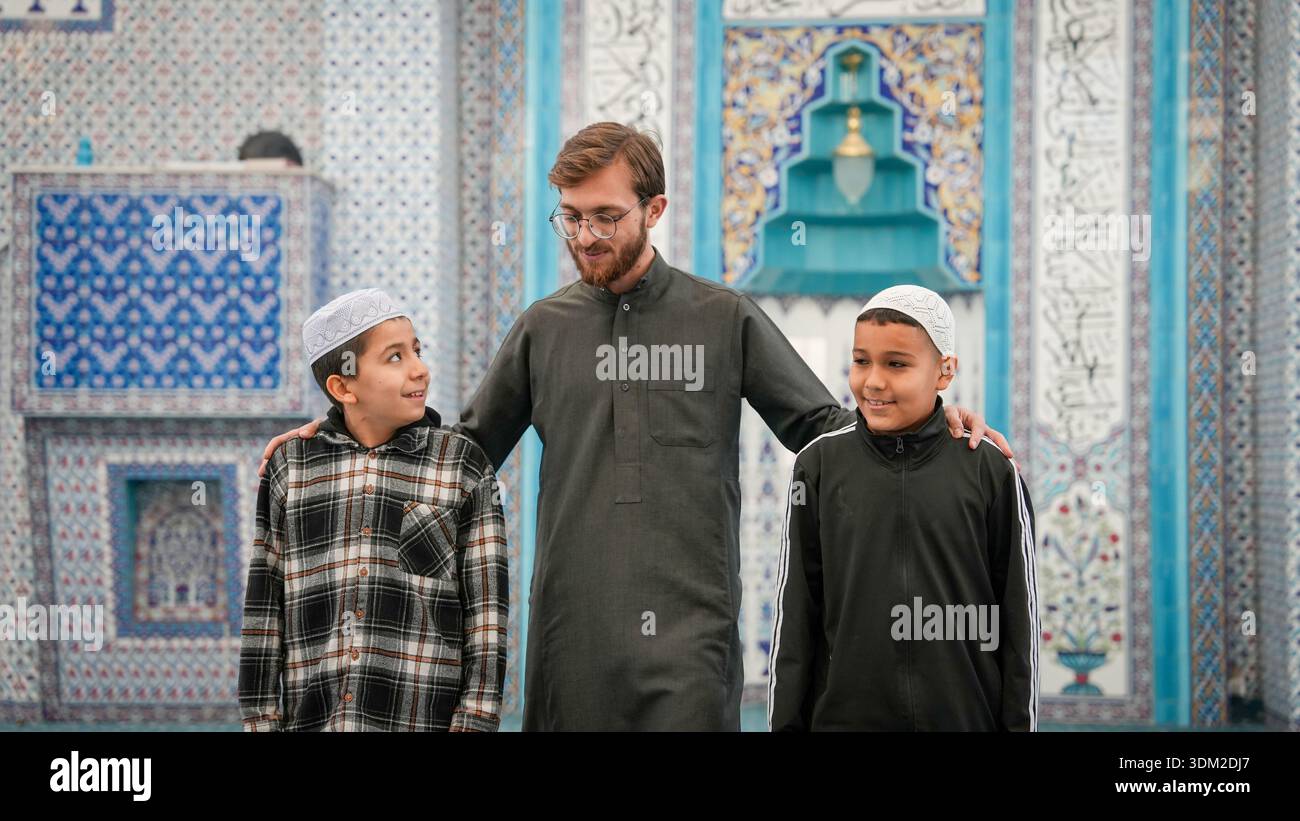 Muslim Sheikh bonding and chatting with Quran students wearing kufi ...