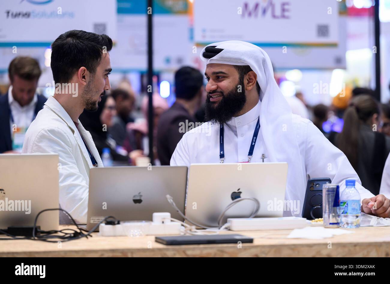 WEB SUMMIT QATAR 2026 DAT THREE Web Summit attendees talk with each ...