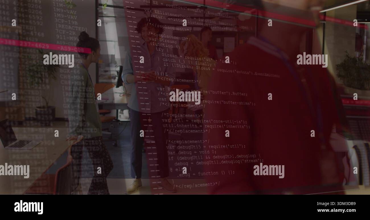 Discussing six coworkers reviewing code on monitors in open plan office, with faint code overlay Stock Photo