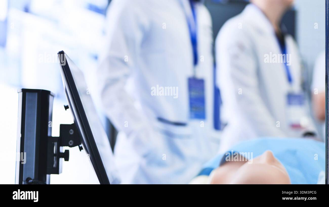 Medical students learning with a simulation dummy during advanced ...