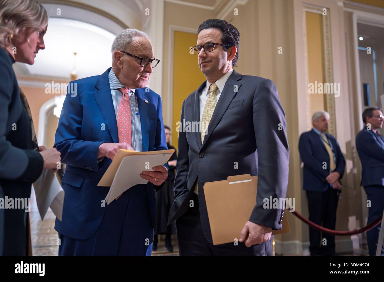 Senate Minority Leader Chuck Schumer, D-N.Y., center, confers with Sen ...