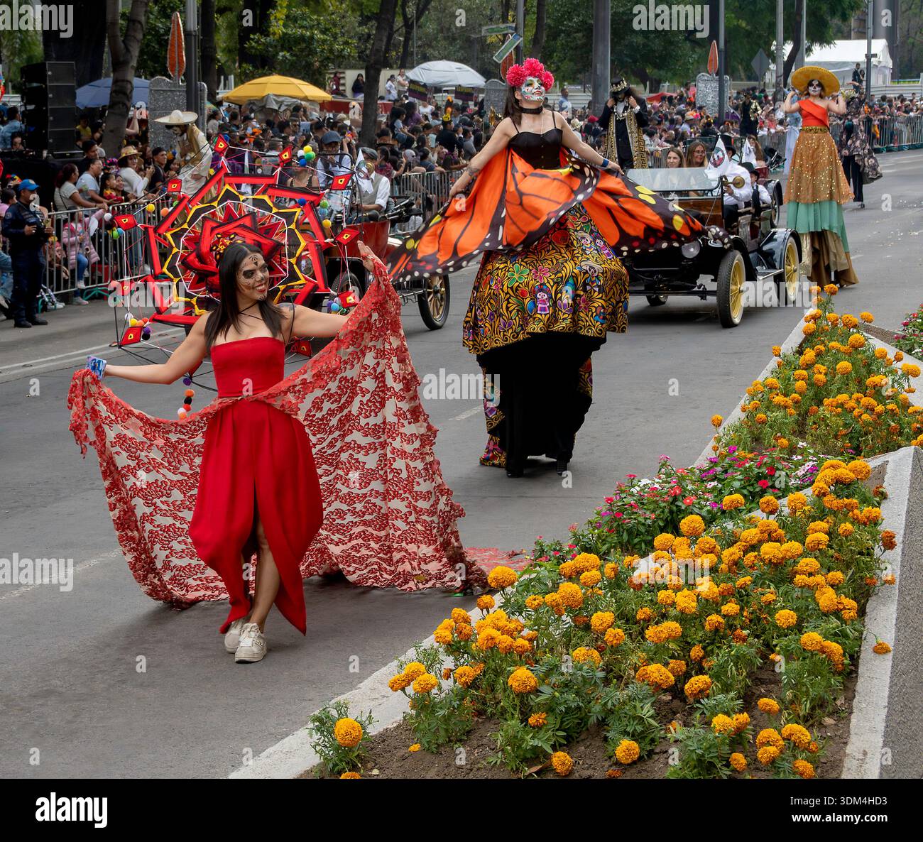 Day of the Dead performers parade with vintage cars in Mexico City, Mexico Stock Photo
