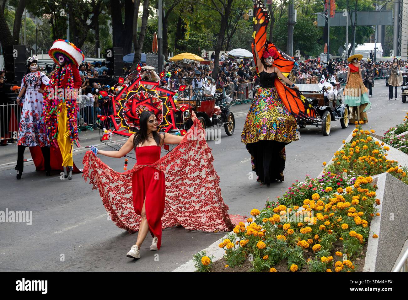 Day of the Dead performers parade with vintage cars in Mexico City, Mexico Stock Photo
