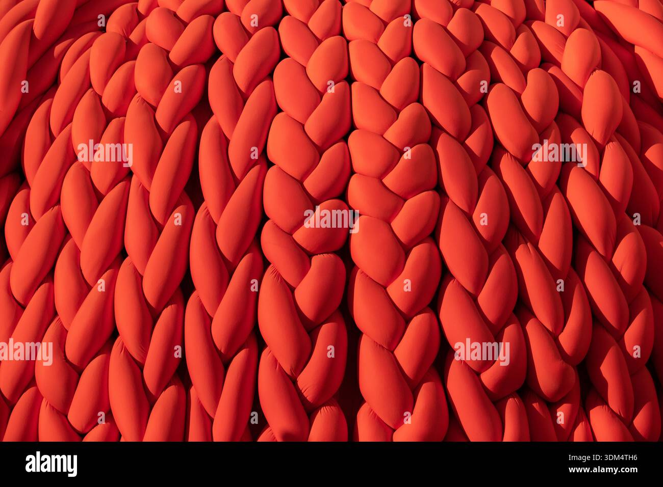 Braided chunky knit pattern creating a warm cozy vibrant textile surface Stock Photo