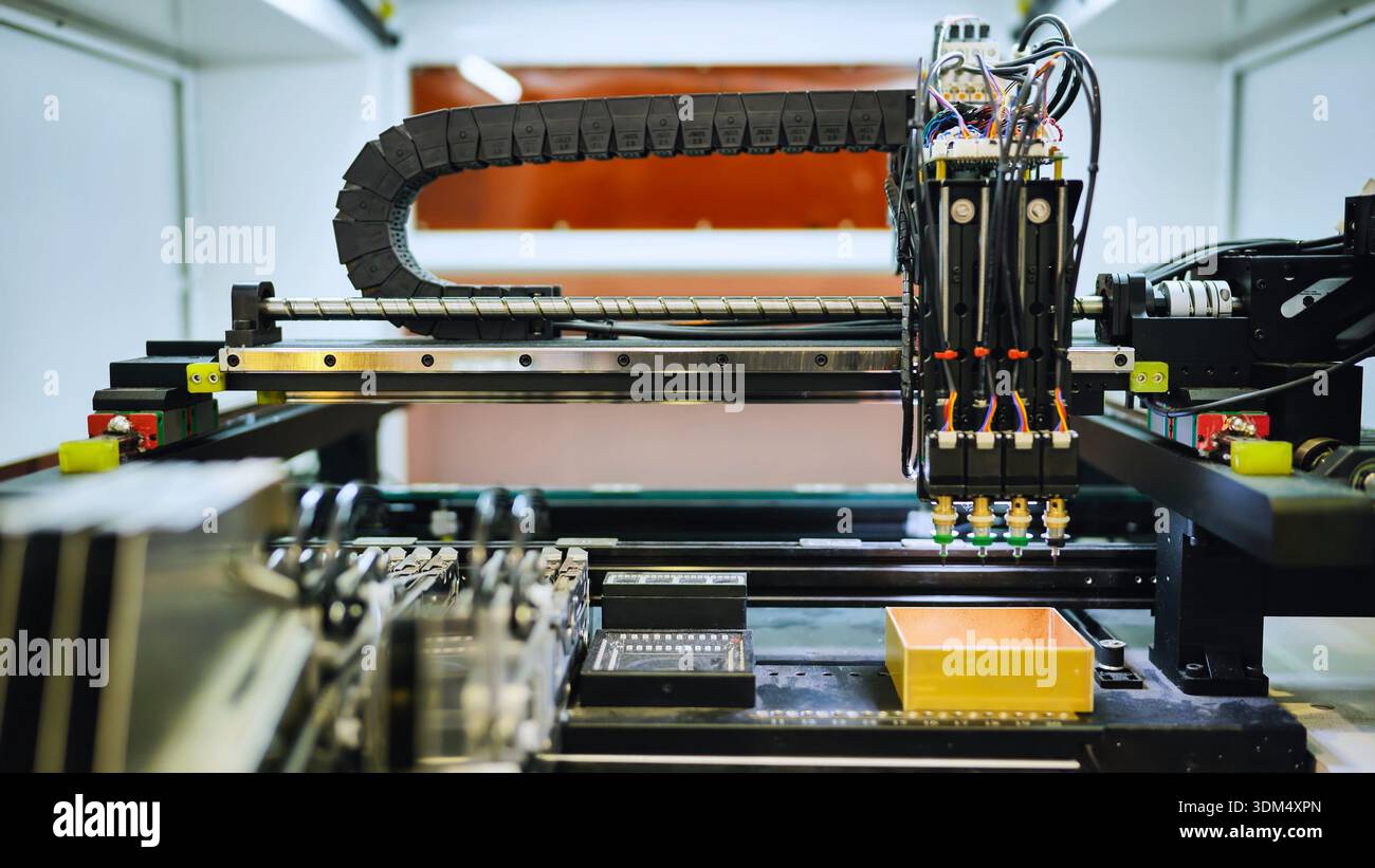 Automated pick and place machine installing electronic components on a circuit board Stock Photo