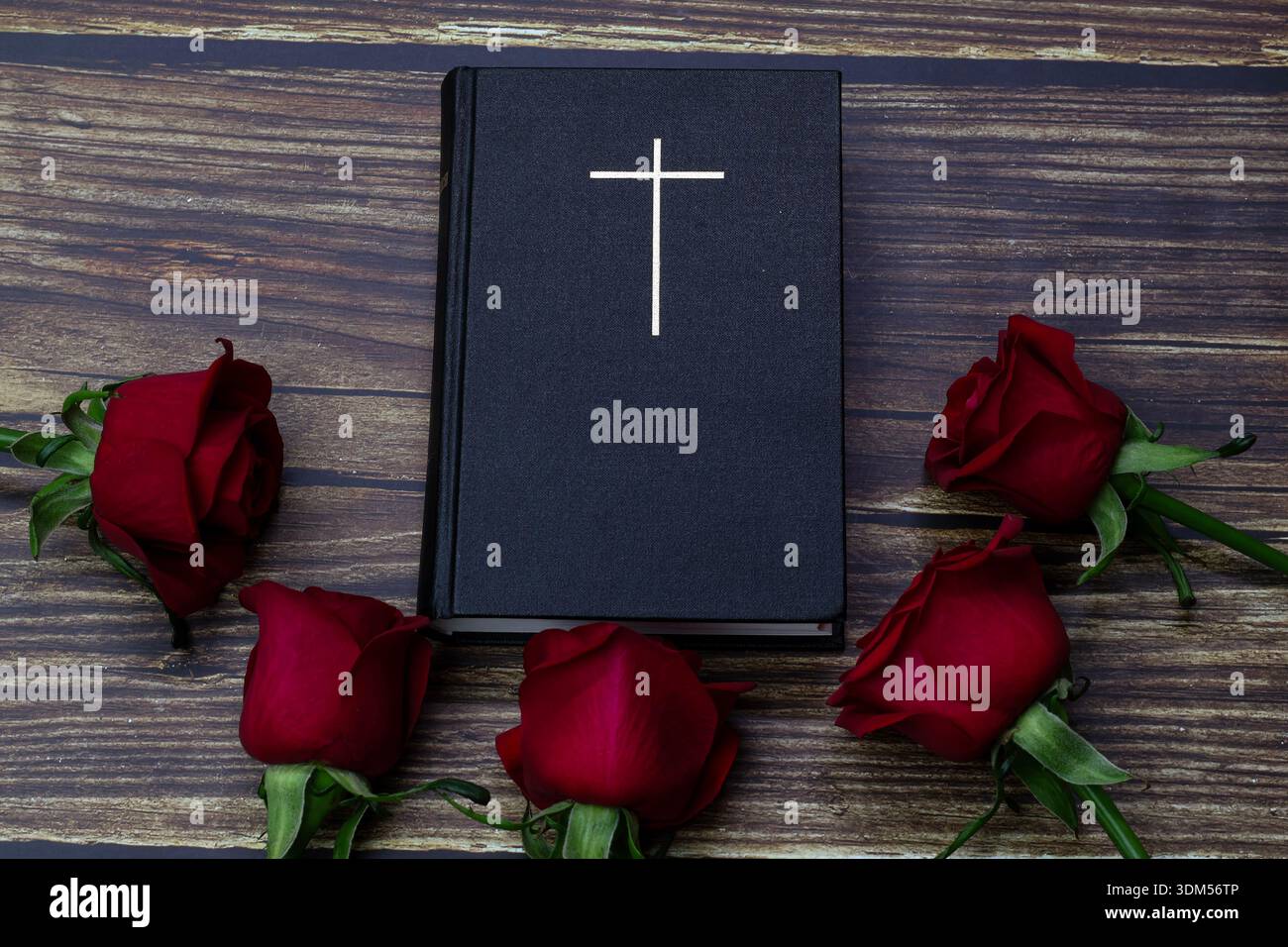 Holy Bible with cross and red roses on wooden background Stock Photo ...
