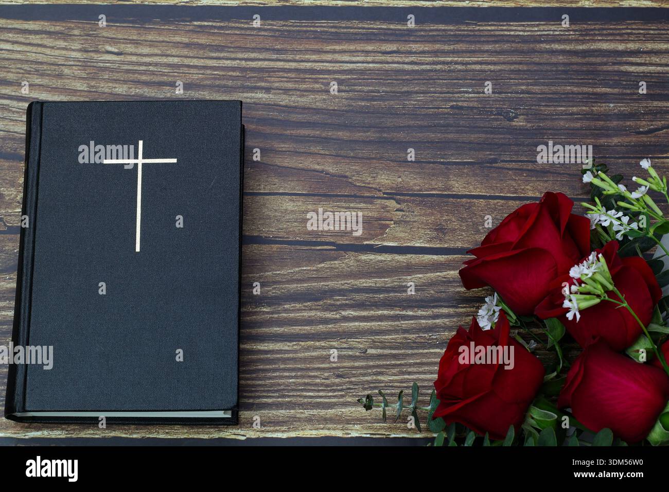 Holy Bible with cross and red roses on wooden background Stock Photo ...