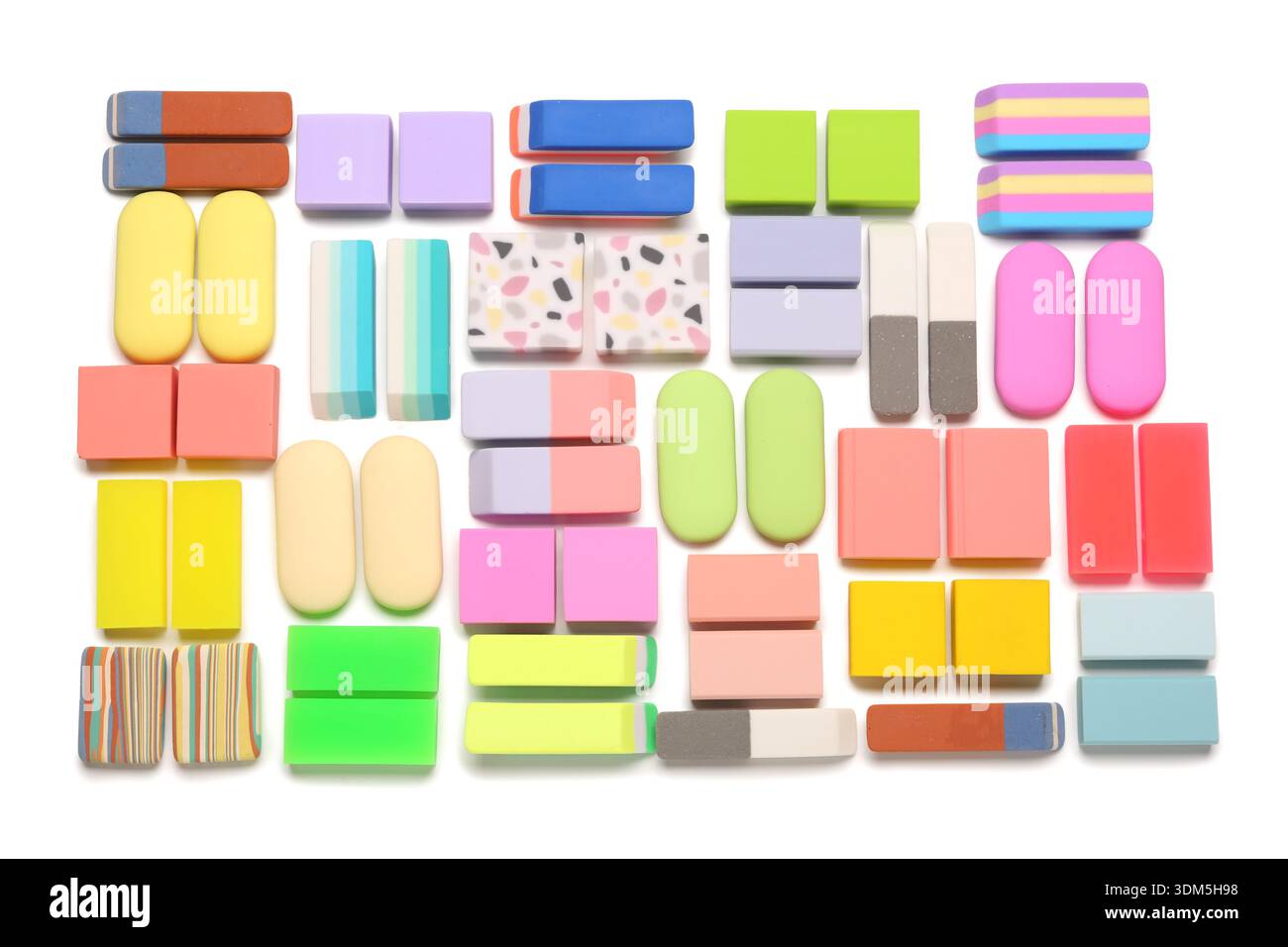 Many colorful rubber erasers on white background Stock Photo