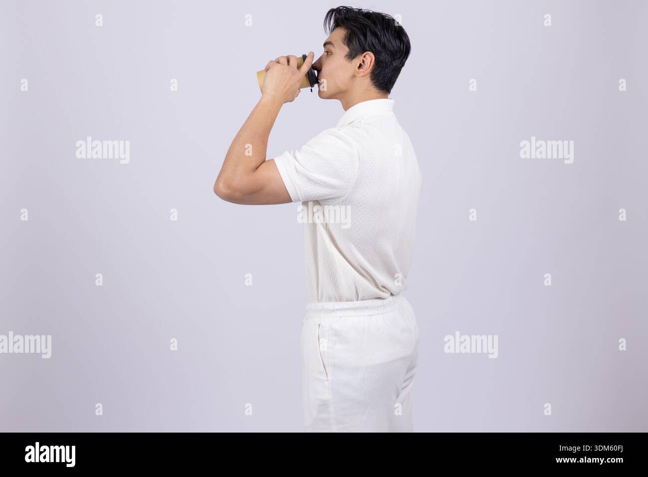 Man in white chef uniform shouting or calling someone Stock Photo