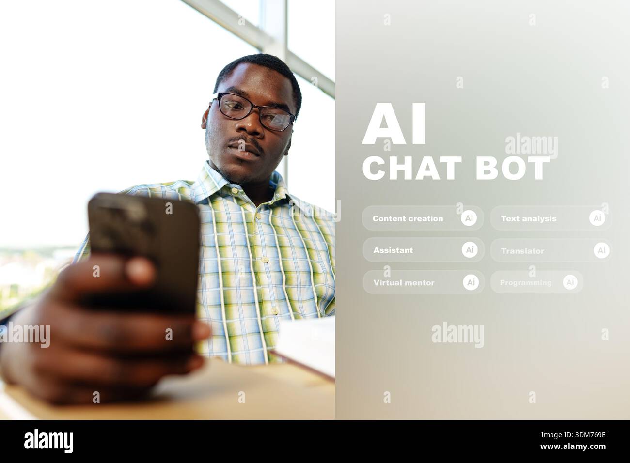Man using smartphone in modern workspace while engaging with AI tools Stock Photo