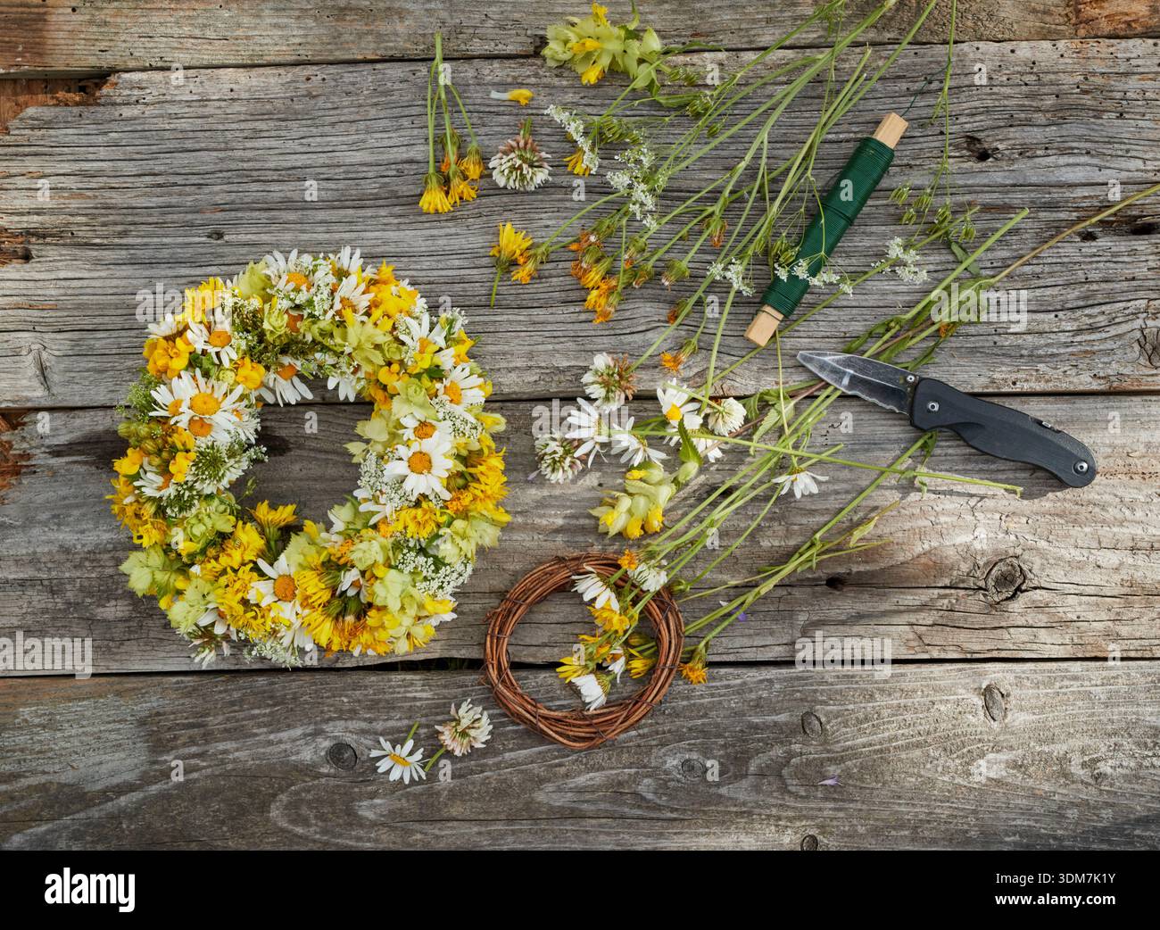 Wreath of meadow flowers from the meadow orchard. Germany Stock Photo