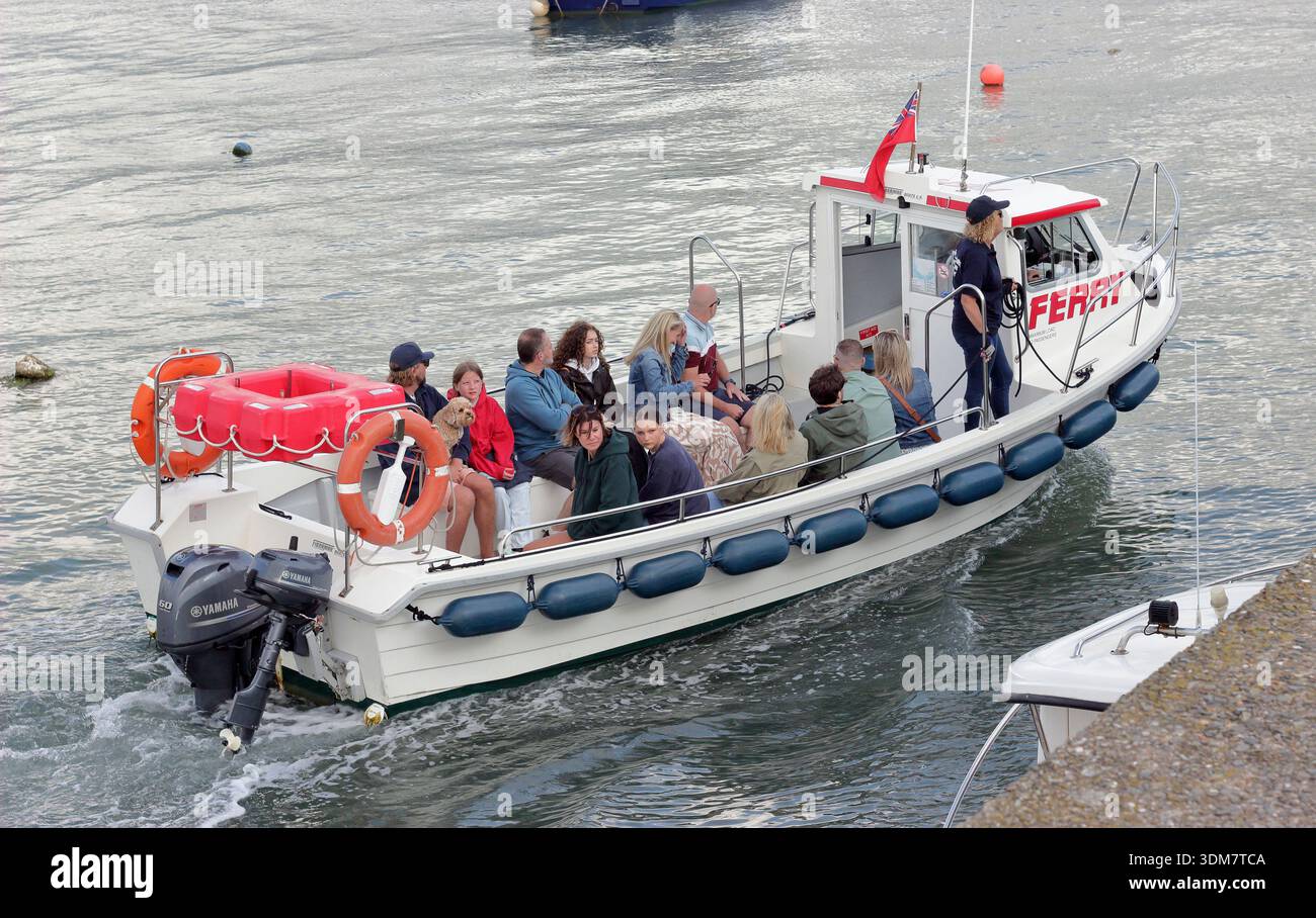 Appledore Instow ferry, North Devon. Travellers aboard the Appledore Instow ferry seen from Appledore Quay, North Devon, England, UK Stock Photo