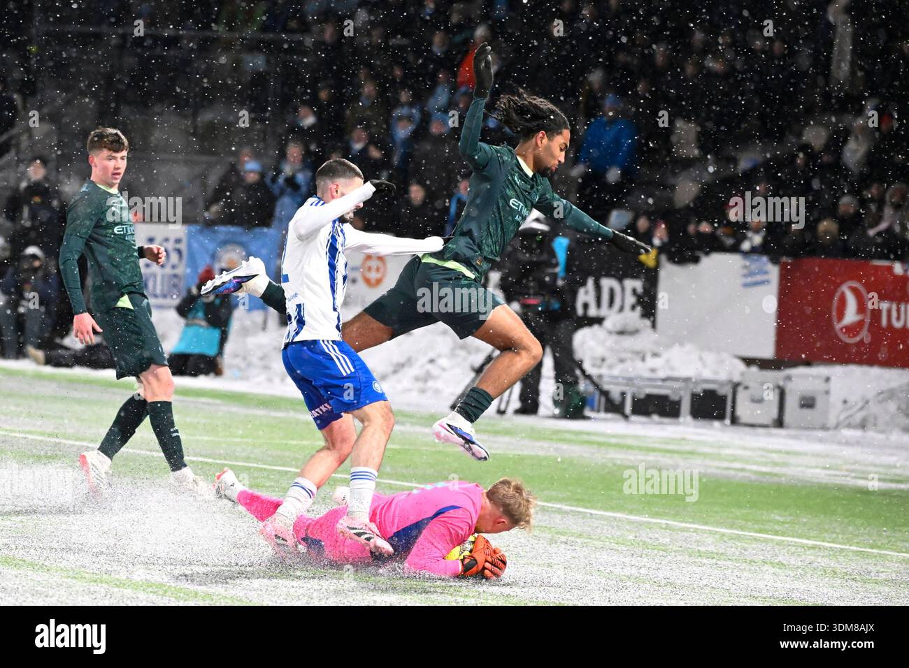 lks-20260204-art-berisha-and-goalkeeper-mitja-haapanen-of-hjk-save