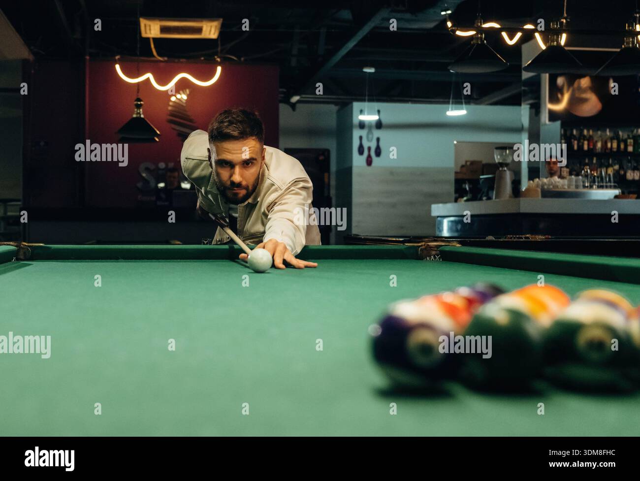 Focused, playing. Handsome man with a pool table game. Stock Photo