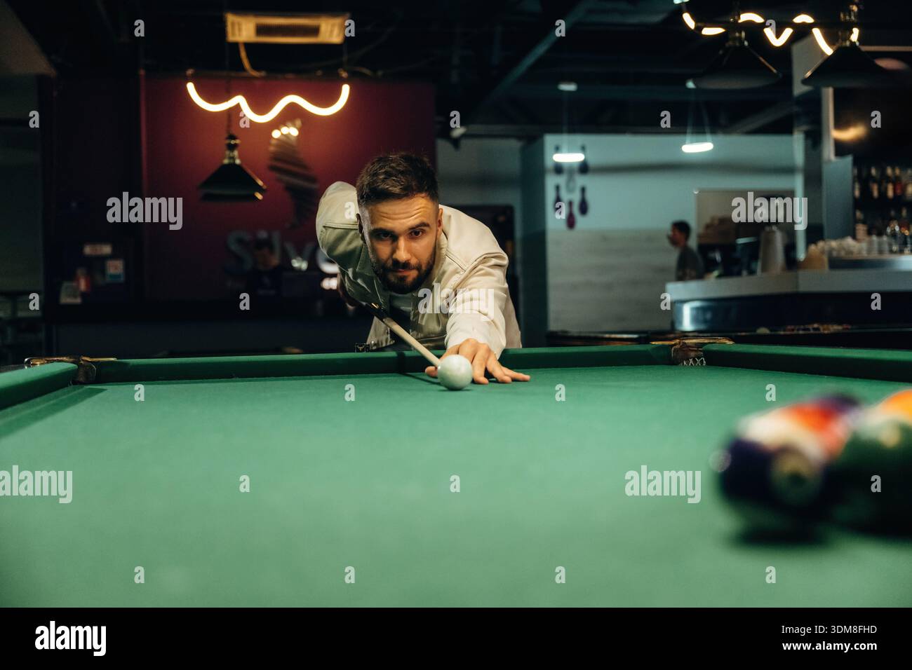 Focused, playing. Handsome man with a pool table game. Stock Photo