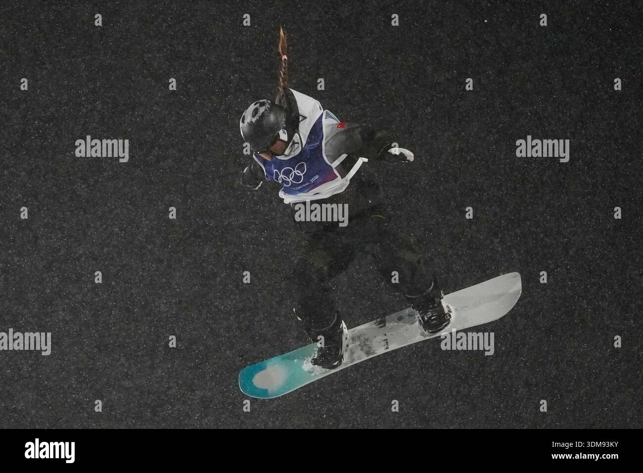 China's Zhang Xiaonan practices during a snowboard big air training ...