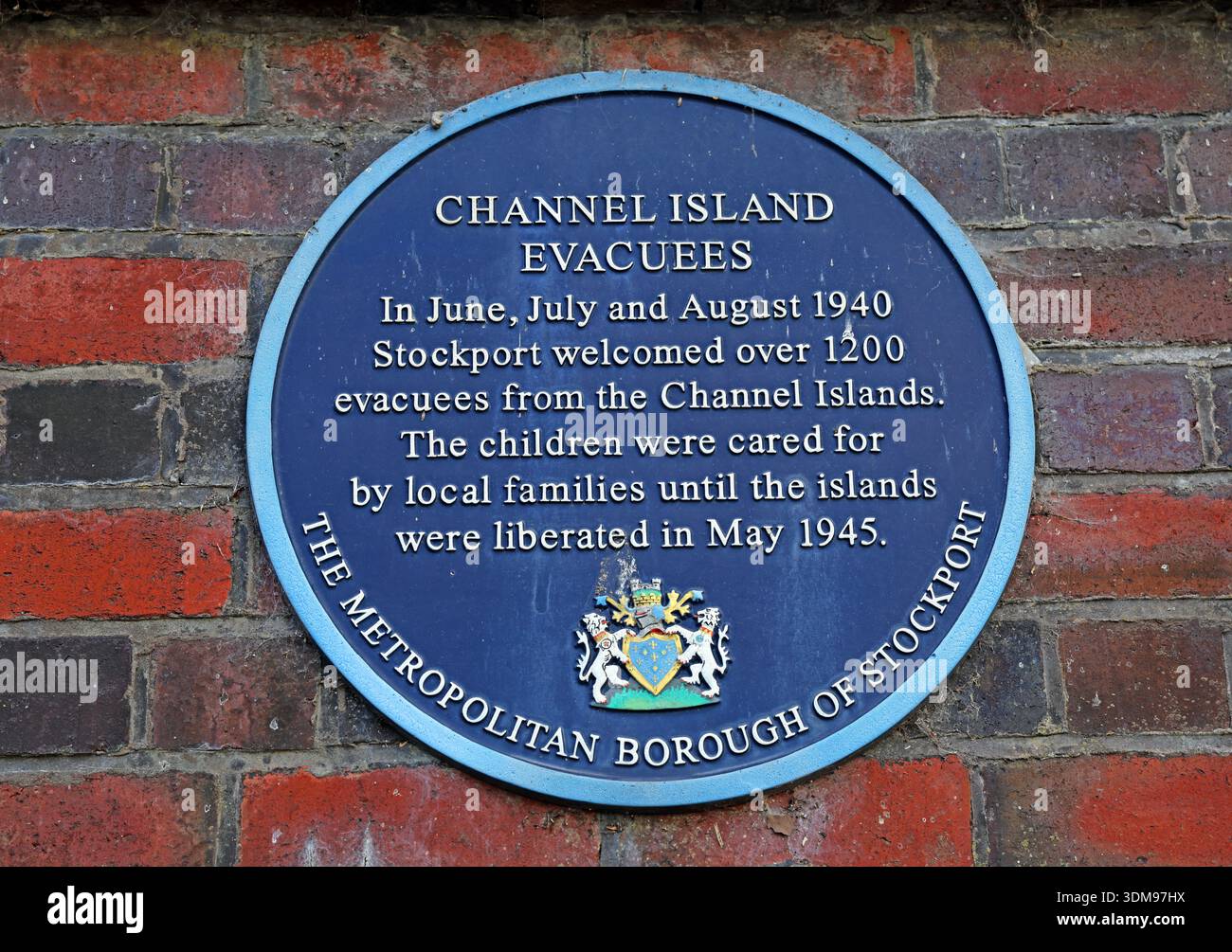 Blue plaque Stockport railway station commemorating Channel Island evacuees welcomed to Stockport summer 1940 during World War II, Greater Manchester Stock Photo