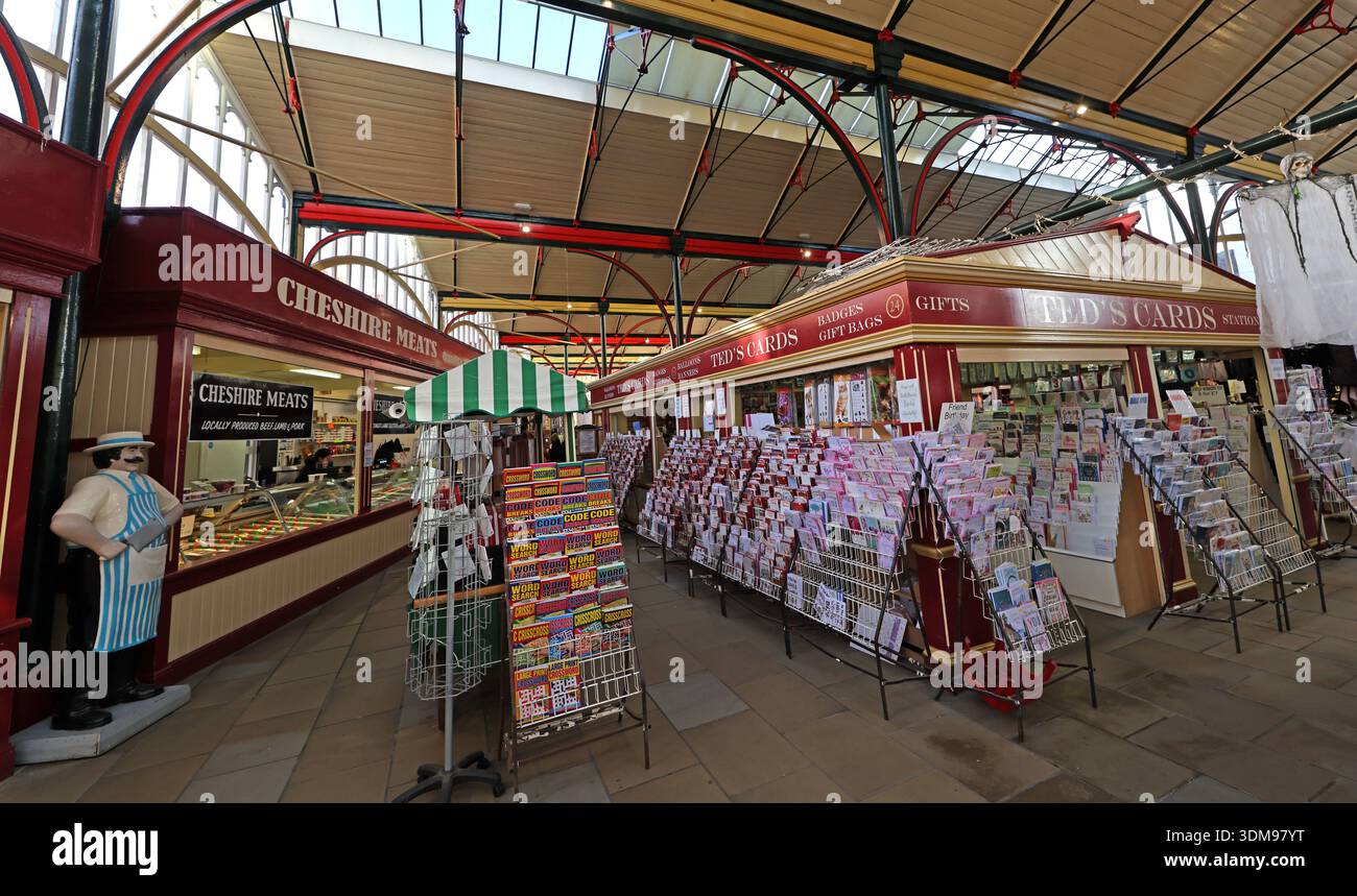 Interior of Stockport Market Hall showing Ted’s Cards greetings card stall and Cheshire Meats butchers counter under the Victorian iron-and-glass roof Stock Photo