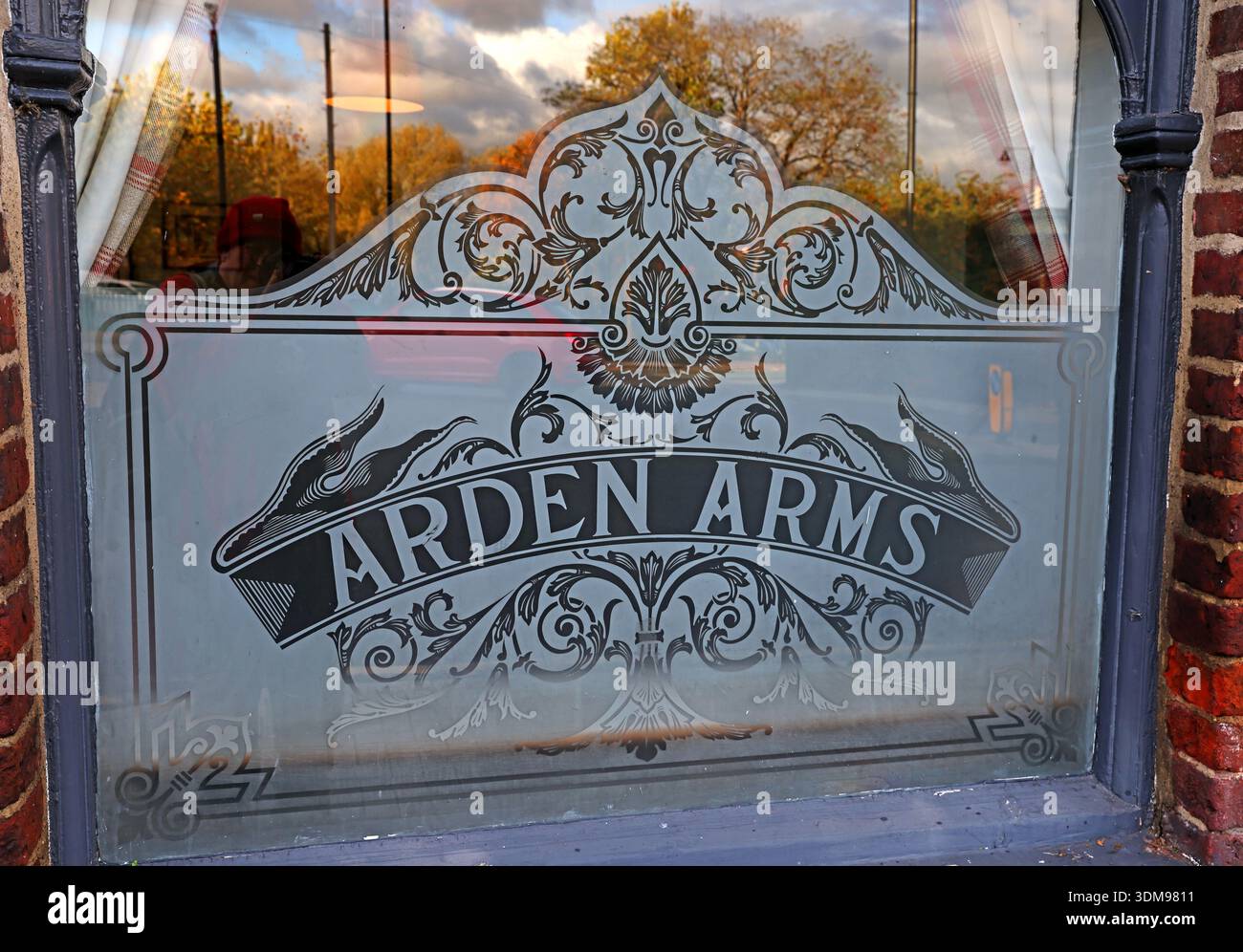 Etched glass window with “ARDEN ARMS” lettering on the Arden Arms public house, 23 Millgate, Stockport, Greater Manchester, England, UK. Stock Photo