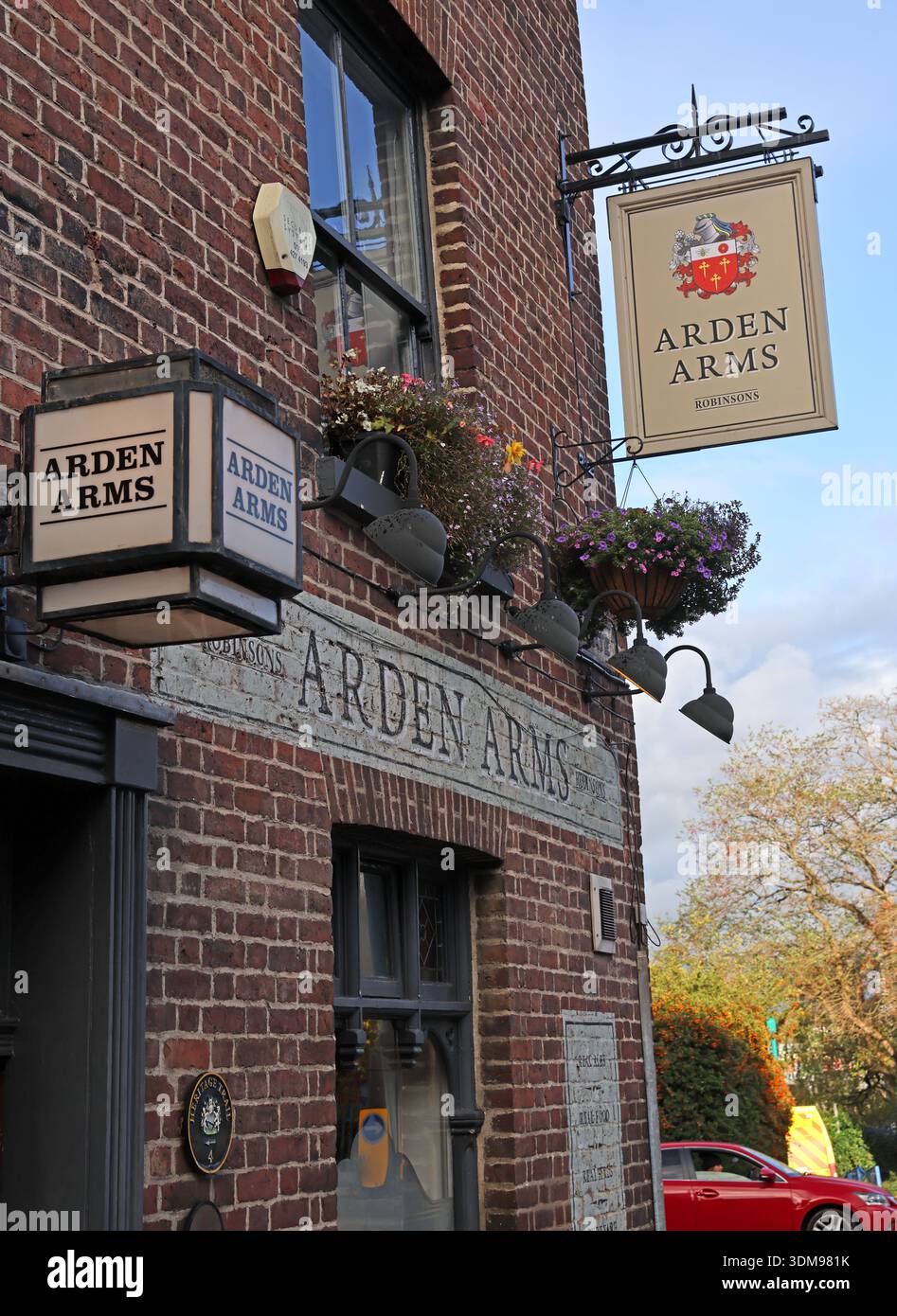 Exterior signage of the Arden Arms public house on Millgate, showing hanging pub signs and brick frontage, Stockport town centre, Greater Manchester Stock Photo