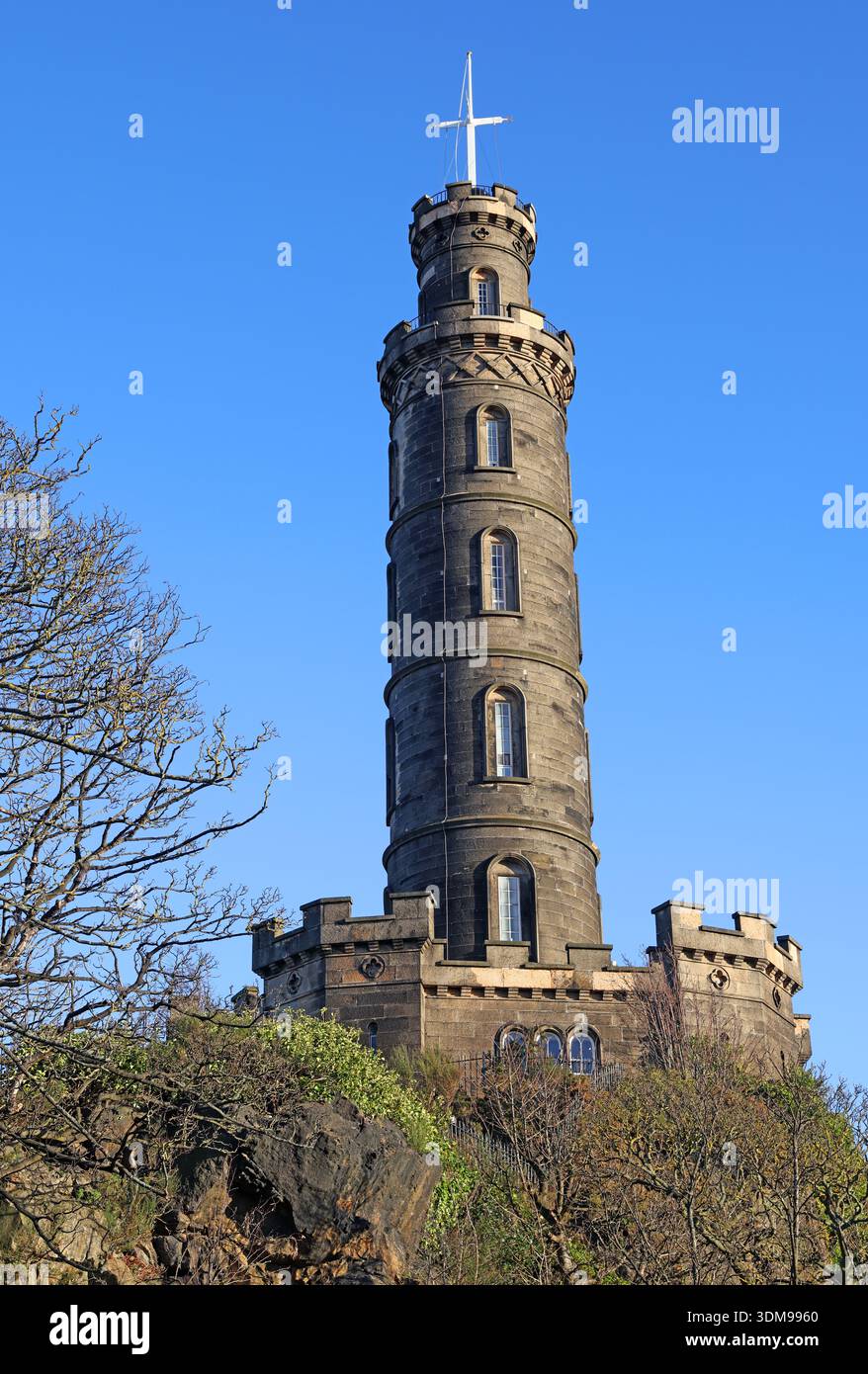Nelson Monument viewing tower on Calton Hill, Edinburgh, Scotland, photographed in bright winter sunshine against a clear blue sky, UK. Stock Photo