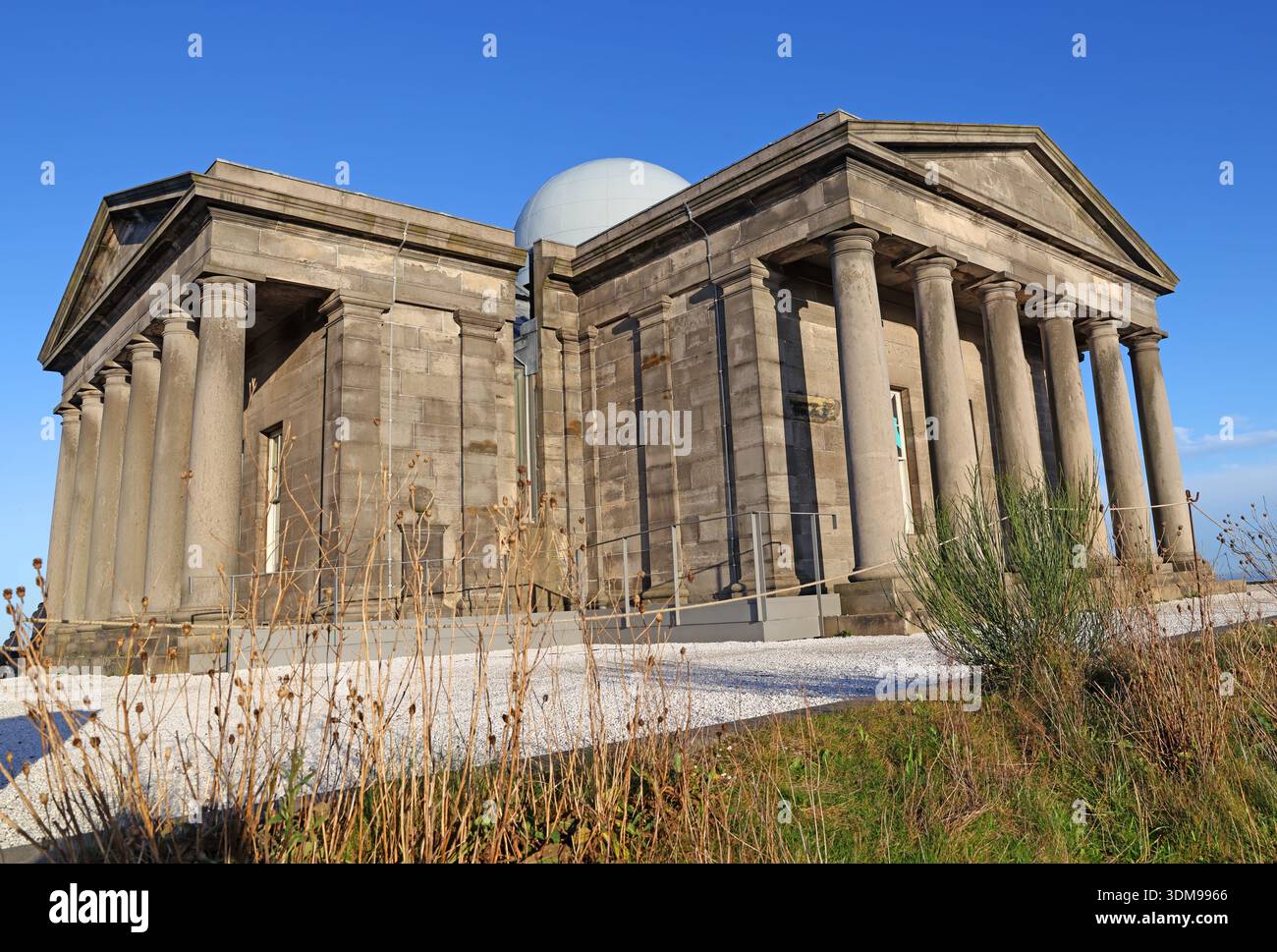 Playfair Monument with observatory dome at the City Observatory on Calton Hill,Edinburgh,photographed in bright winter sunshine under a clear blue sky Stock Photo
