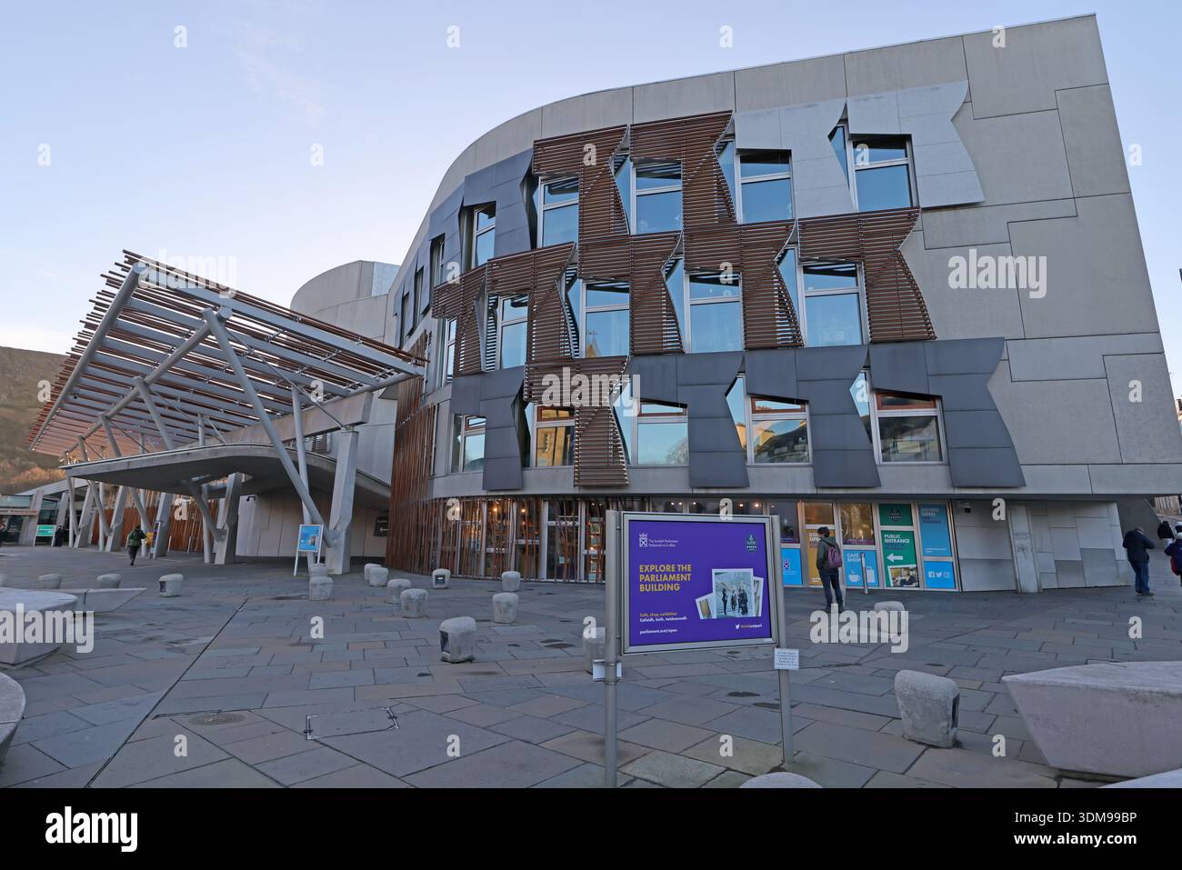 Exterior of the Scottish Parliament Building at Holyrood with visitor entrance area and “Explore the Parliament Building” sign, Horse Wynd, Edinburgh, Stock Photo