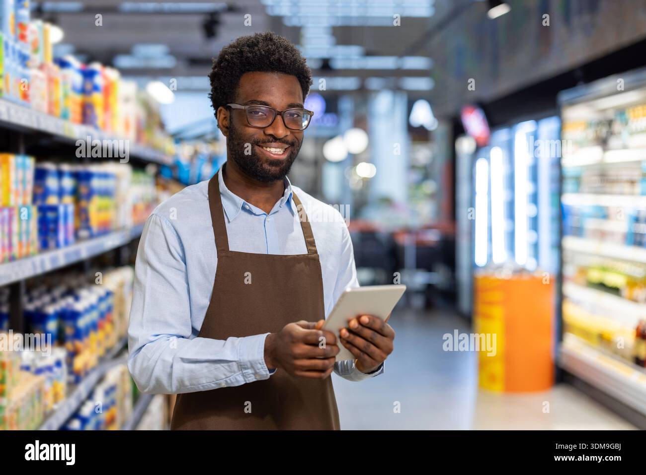 Friendly store employee managing hi-res stock photography and images ...