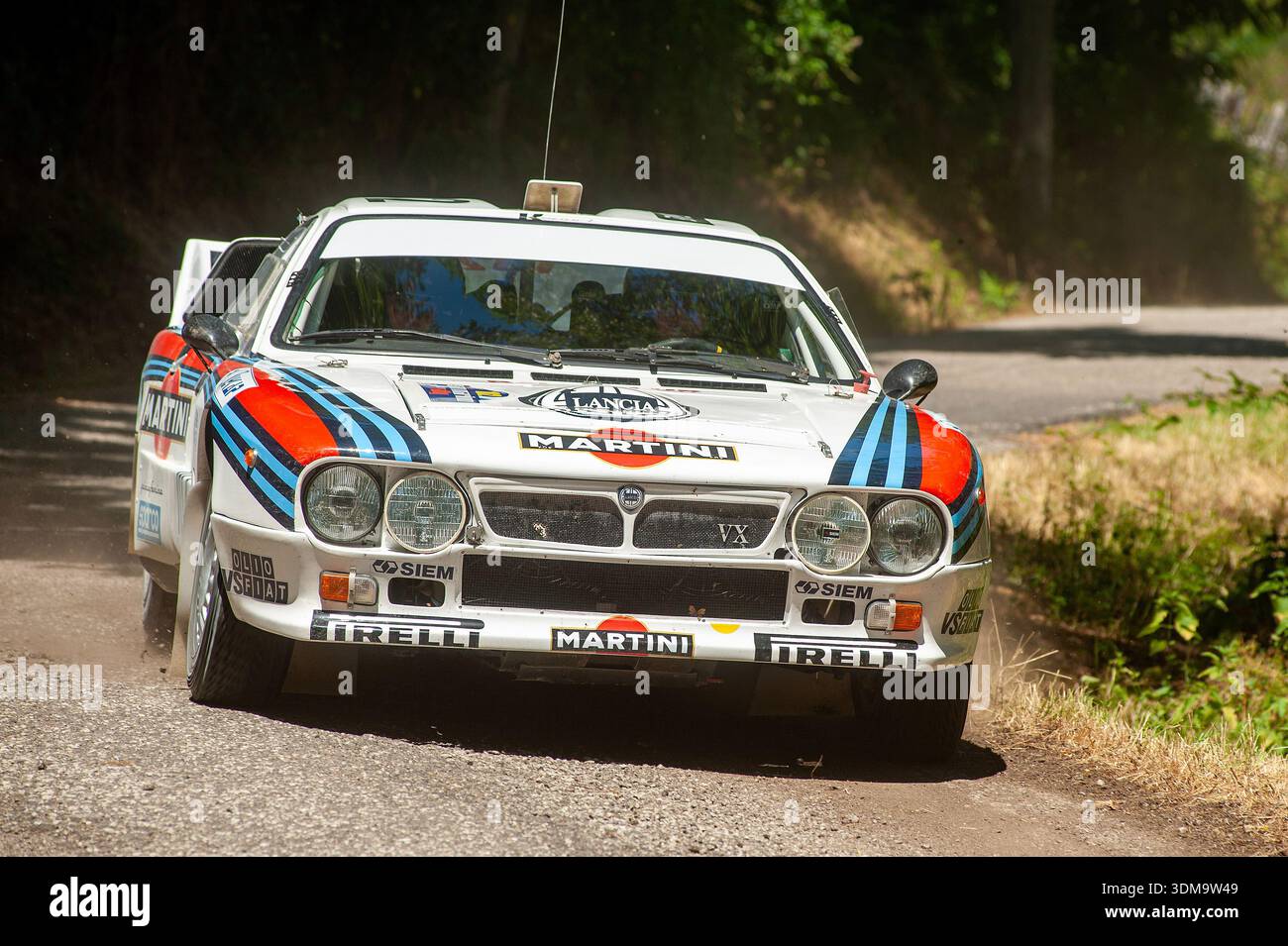 Lancia 037 Martini rally car racing on a gravel special stage