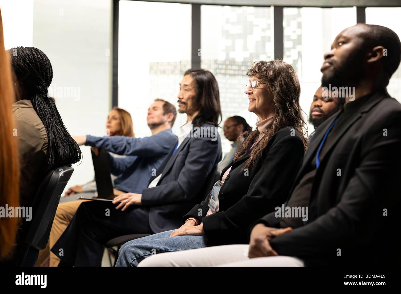 International business event with professional diverse attendees seated ...