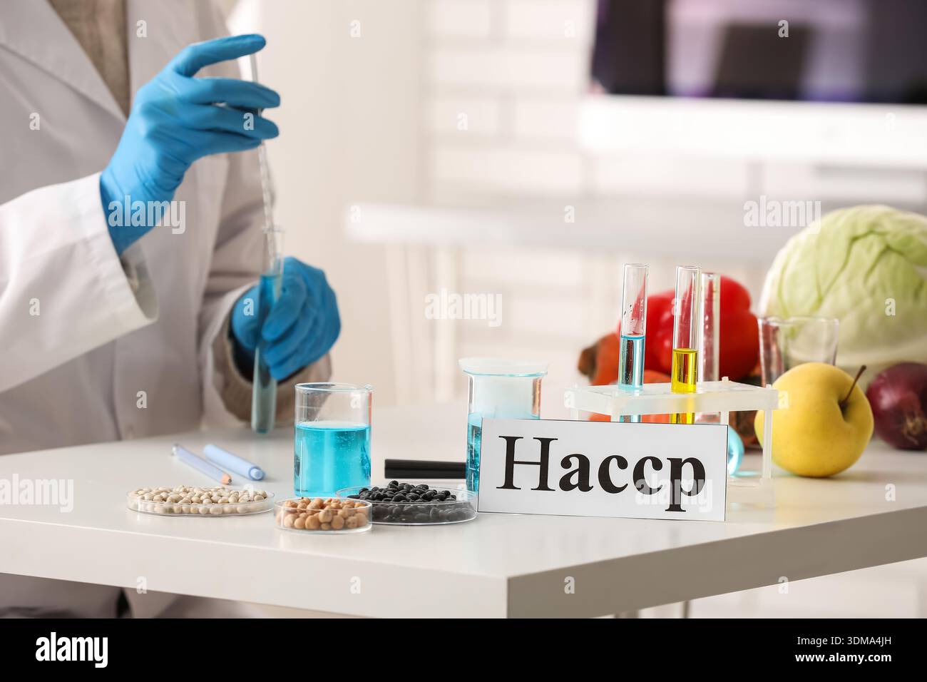 Scientist testing products in laboratory. HACCP concept Stock Photo