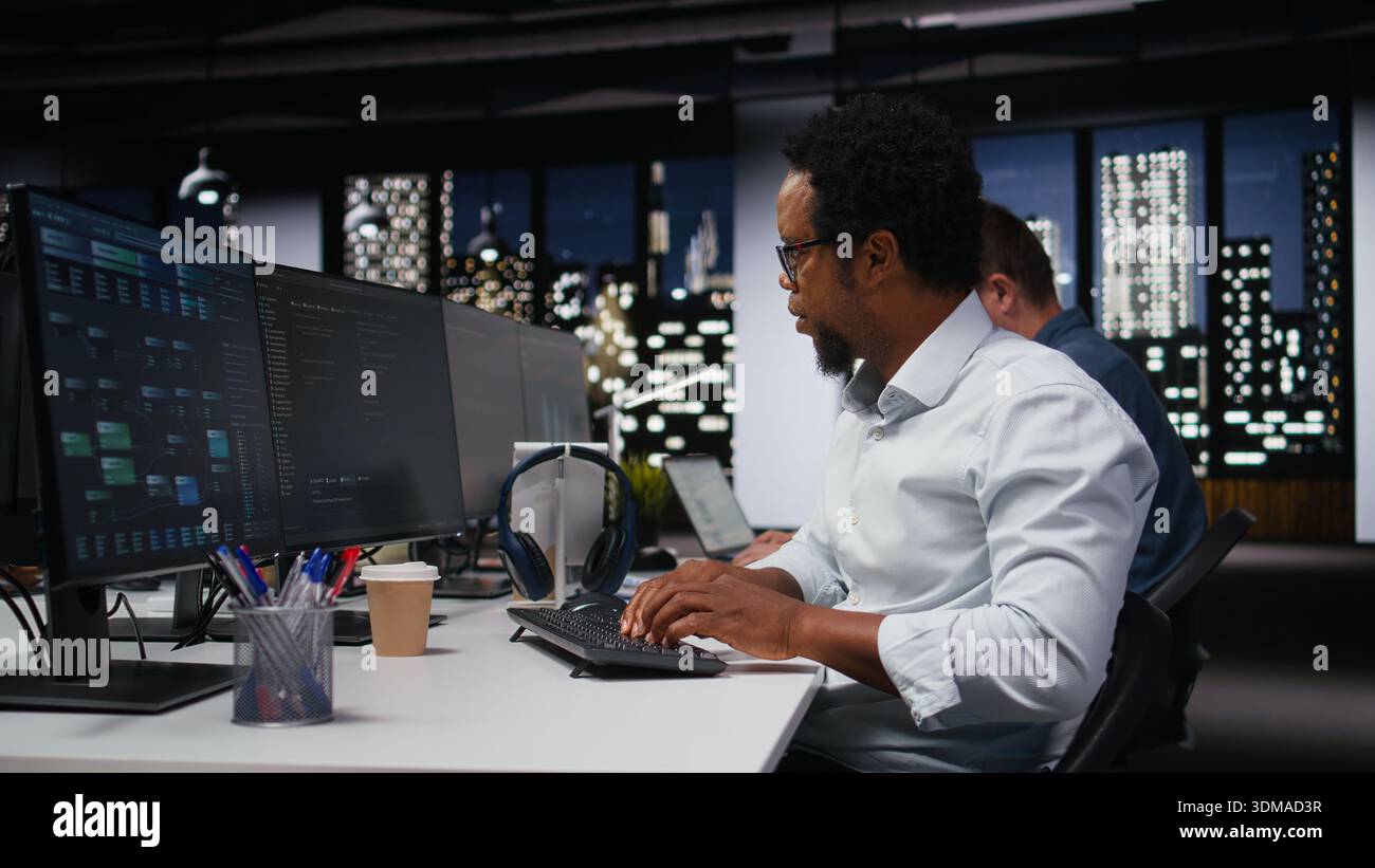 Software developer in company workplace doing artificial intelligence tech quality assurance. IT startup employee in office typing on keyboard, writing AI script with programming languages Stock Photo